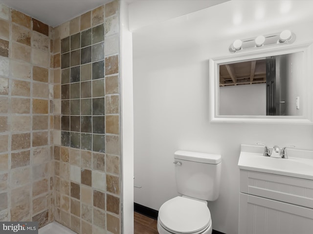 607 N Longwood St, Baltimore, MD 21216 - full bath with a tile shower, toilet, and vanity
