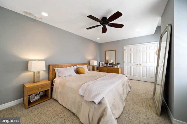 bedroom featuring baseboards, light colored carpet, recessed lighting, a closet, and a ceiling fan