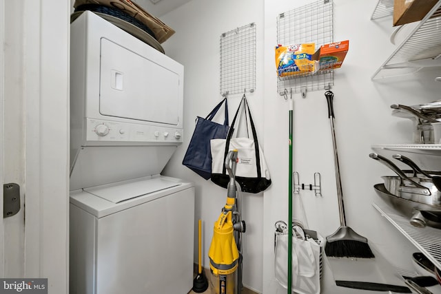 laundry area with laundry area and stacked washer and dryer