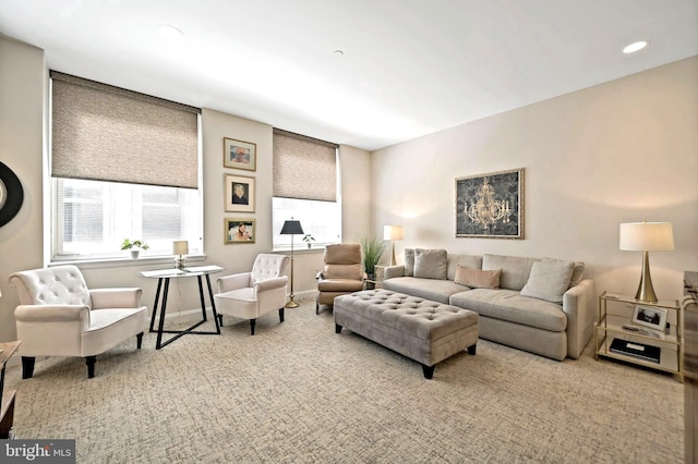 living area featuring recessed lighting, baseboards, and carpet floors