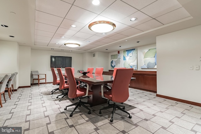 carpeted dining area featuring recessed lighting, baseboards, and a drop ceiling