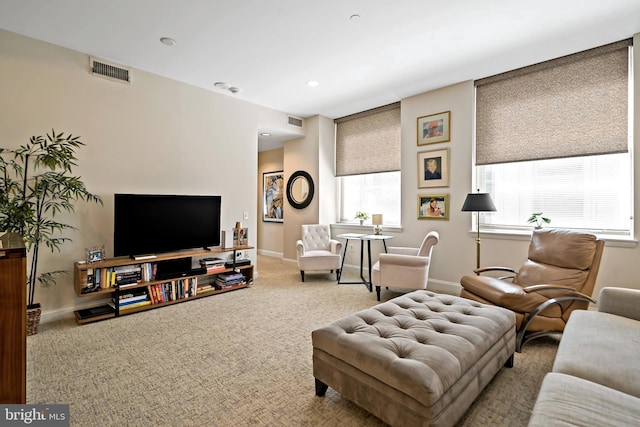 carpeted living room featuring recessed lighting, visible vents, and baseboards