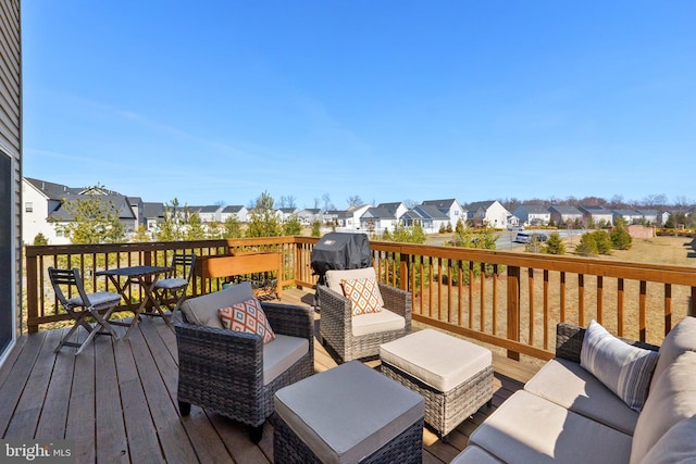 deck featuring a residential view, a grill, and an outdoor hangout area