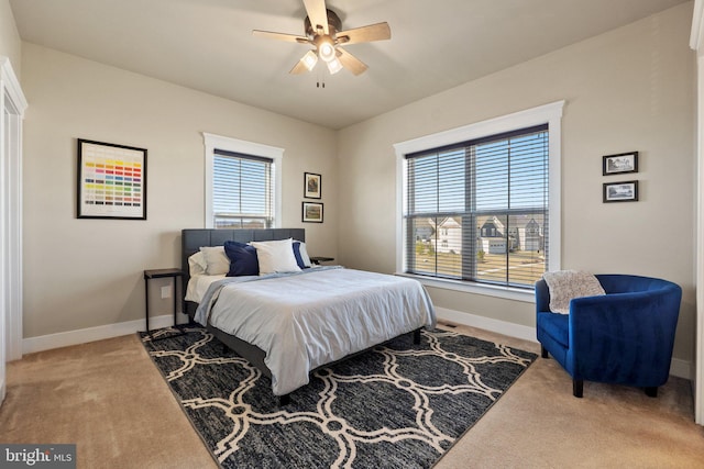 bedroom featuring a ceiling fan, baseboards, and carpet floors