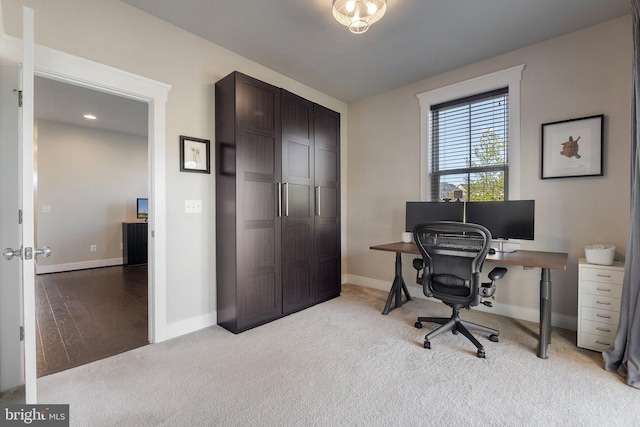 office space with carpet flooring and baseboards