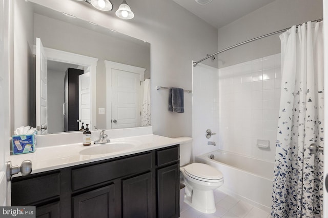 bathroom with tile patterned floors, toilet, vanity, and shower / bathtub combination with curtain