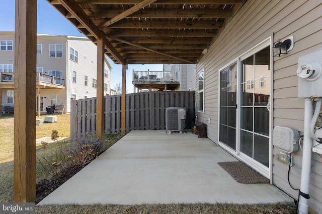 view of patio / terrace featuring fence and central AC