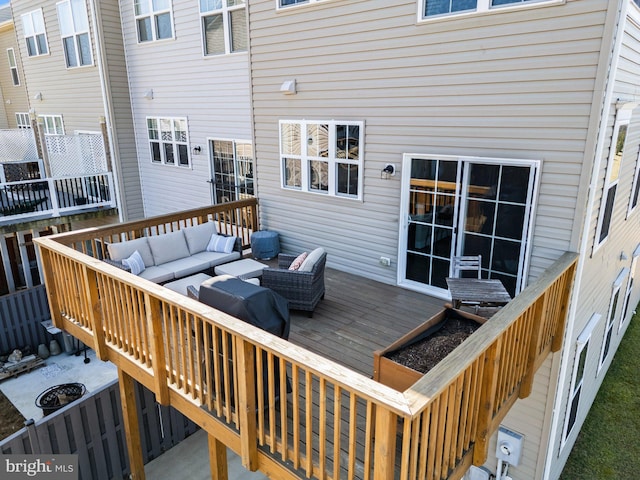 wooden terrace featuring an outdoor hangout area