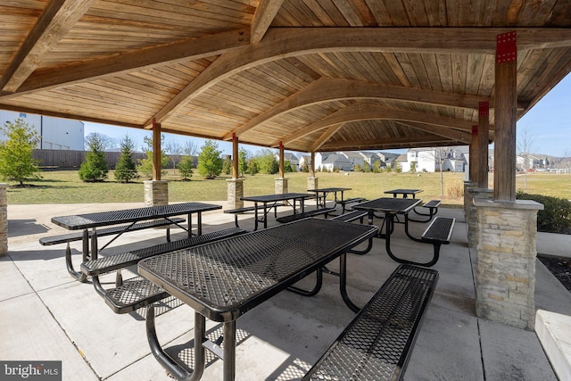 view of community featuring a gazebo, a yard, and a patio