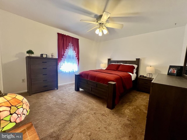 bedroom featuring baseboards, ceiling fan, and carpet flooring