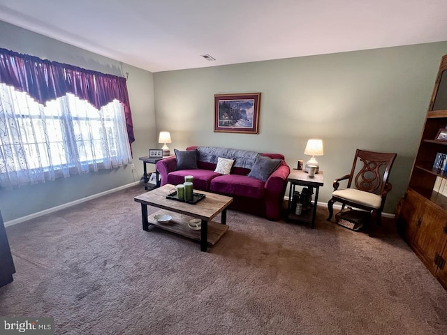 carpeted living room with visible vents and baseboards