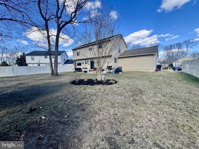 rear view of property with fence