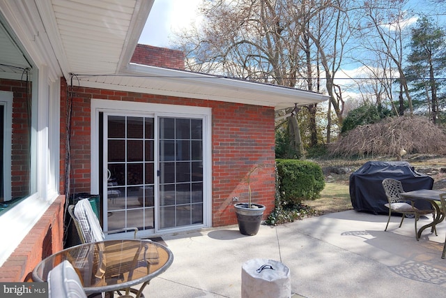 view of patio with a grill