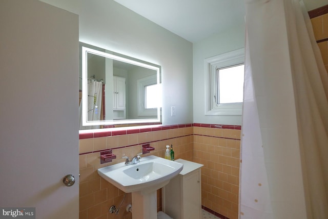 bathroom with tile walls and wainscoting