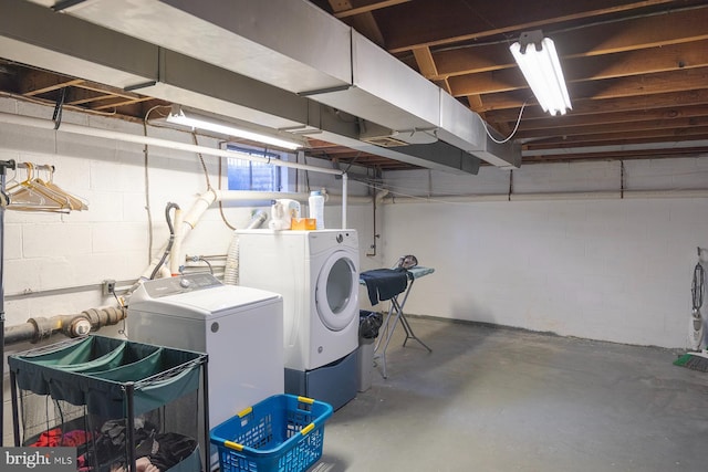 unfinished basement featuring separate washer and dryer