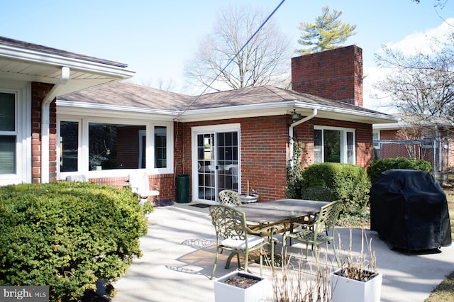 view of patio with a grill and outdoor dining space