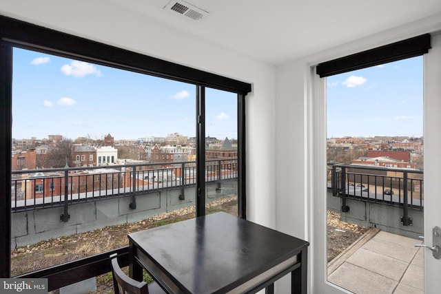 interior space featuring a view of city and visible vents