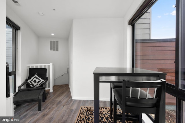 interior space with visible vents and wood finished floors