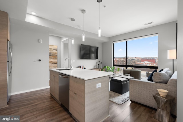 kitchen featuring visible vents, modern cabinets, open floor plan, dark wood finished floors, and stainless steel appliances