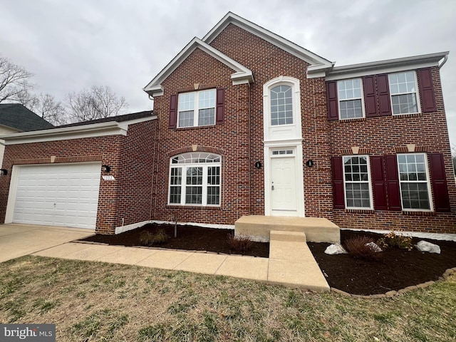 traditional home with a garage, concrete driveway, and brick siding