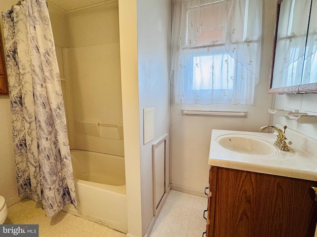 full bathroom featuring tile patterned floors, shower / tub combo with curtain, toilet, baseboards, and vanity