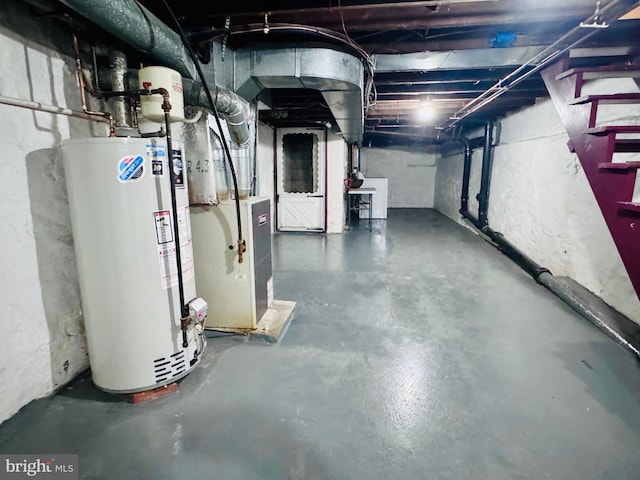 unfinished basement featuring gas water heater