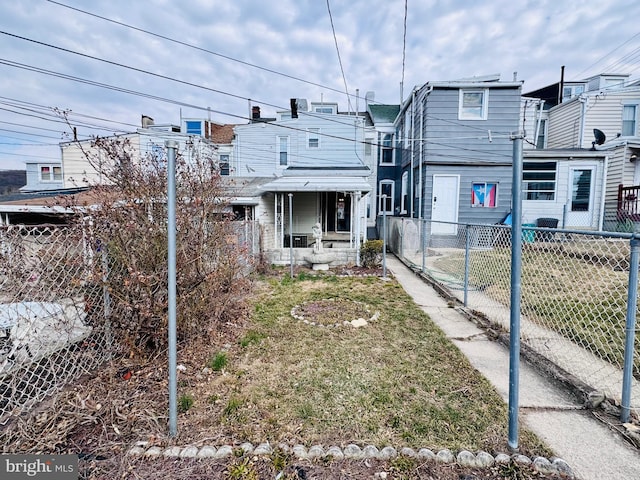 back of property with fence