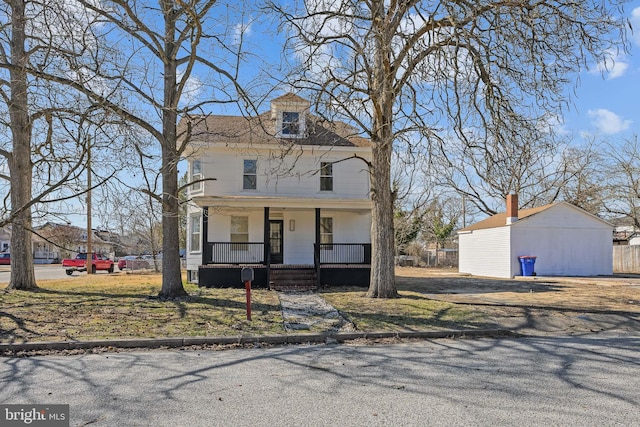 american foursquare style home with a porch