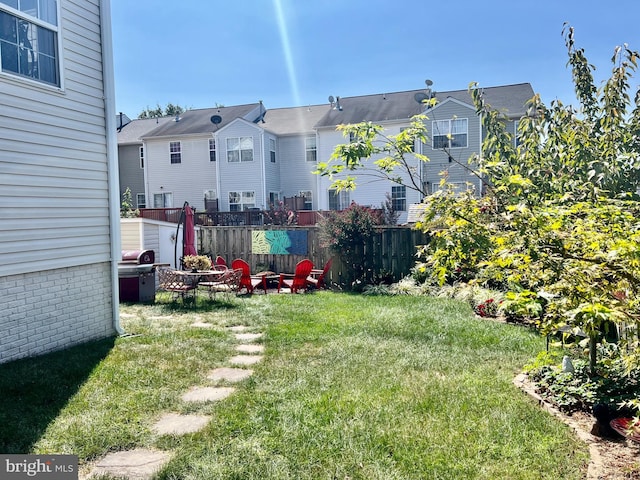 view of yard with a residential view and fence