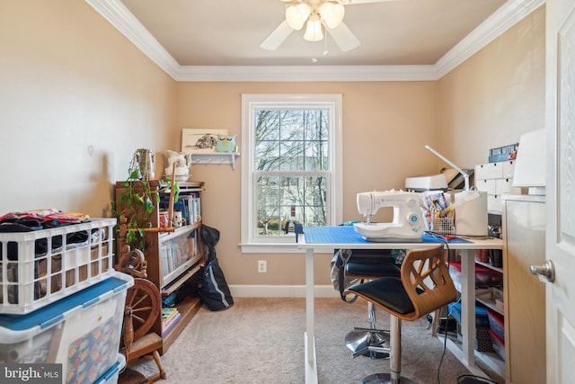 carpeted home office with ceiling fan, baseboards, and ornamental molding