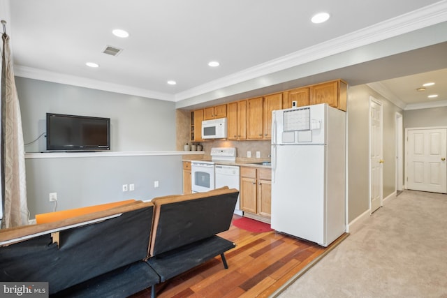 kitchen with white appliances, visible vents, recessed lighting, ornamental molding, and light countertops