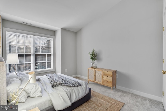 bedroom featuring visible vents, baseboards, and carpet floors