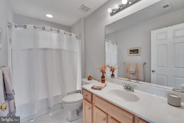 full bathroom with vanity, tile patterned floors, toilet, and visible vents