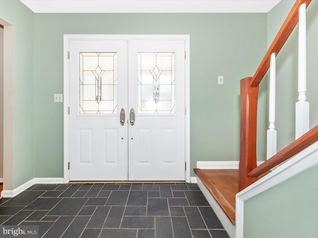 entryway with stairway, french doors, and baseboards