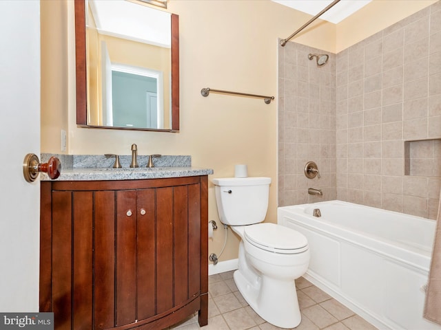 bathroom featuring tile patterned floors, tub / shower combination, toilet, and vanity