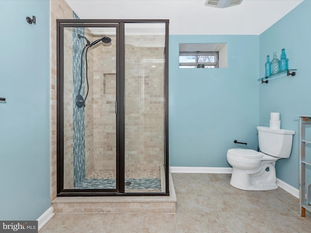 full bathroom with baseboards, toilet, and a shower stall