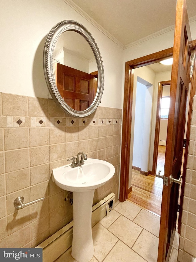 bathroom featuring tile walls and crown molding