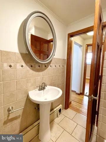 bathroom with ornamental molding, tile walls, and tile patterned floors