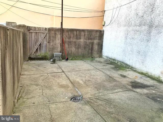 view of patio featuring fence