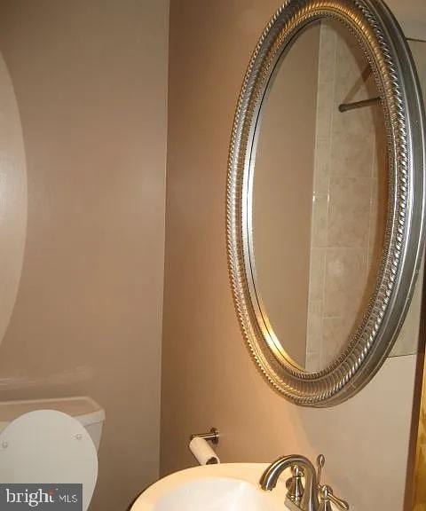 bathroom featuring a sink and toilet