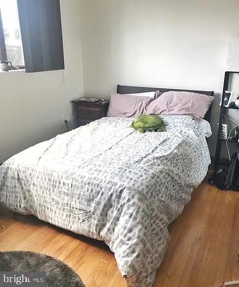 bedroom featuring wood finished floors