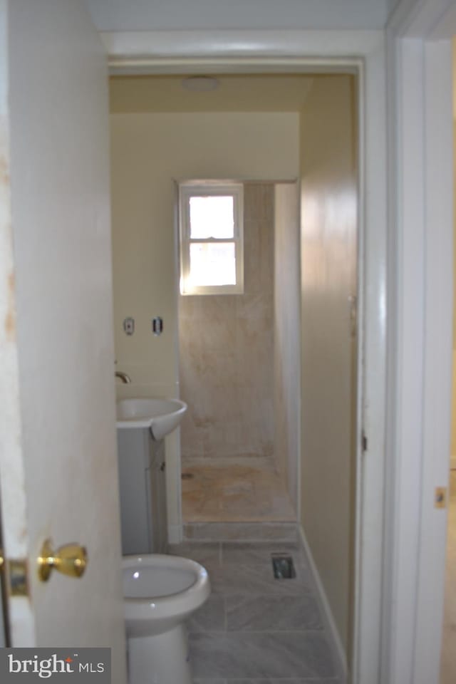 bathroom with toilet, a stall shower, and vanity