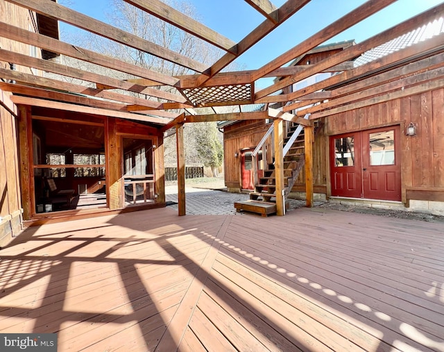 wooden deck with stairway and a pergola