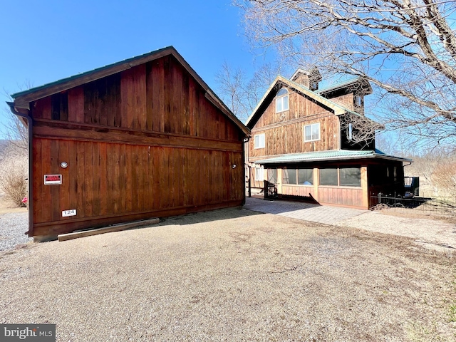 view of home's exterior with a chimney