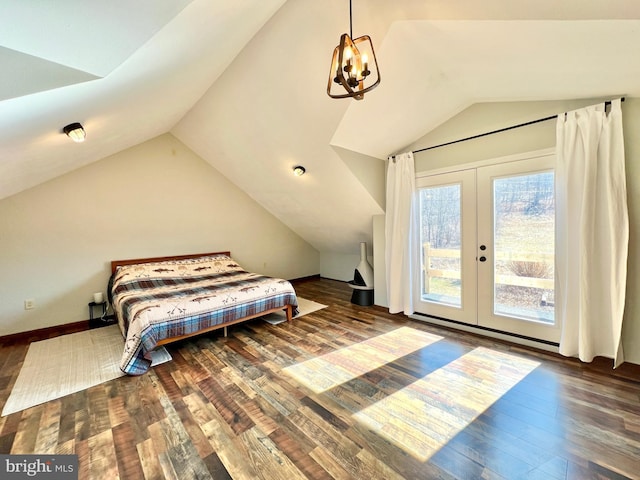 bedroom with lofted ceiling, french doors, wood finished floors, and access to exterior