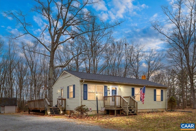 ranch-style house with a wooden deck