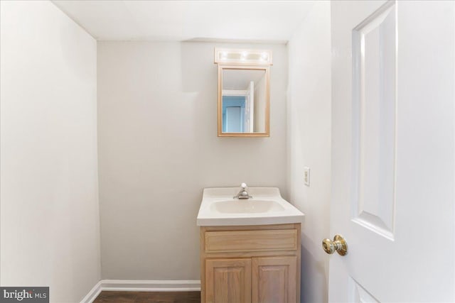 bathroom featuring vanity and baseboards