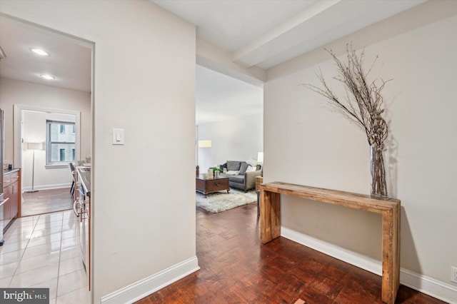 corridor with recessed lighting and baseboards