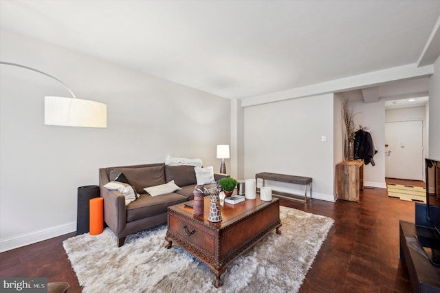 living room with wood finished floors and baseboards