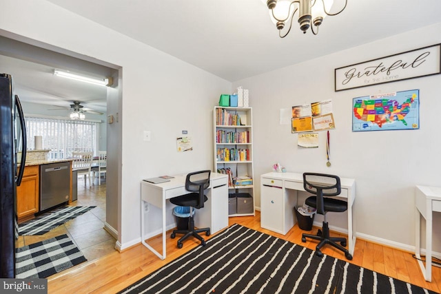 office featuring baseboards, light wood-style floors, and an inviting chandelier